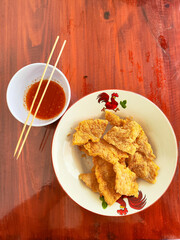 Delicious Fried Soybean Cake Tempe Served on a Plate as Savory and Crunchy Snack