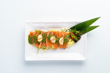 Fresh Salmon Sashimi with Garnish on White Plate