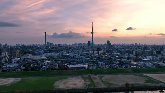 Aerial view of Tokyo metropolis and sunset sky over the city skyline.take off