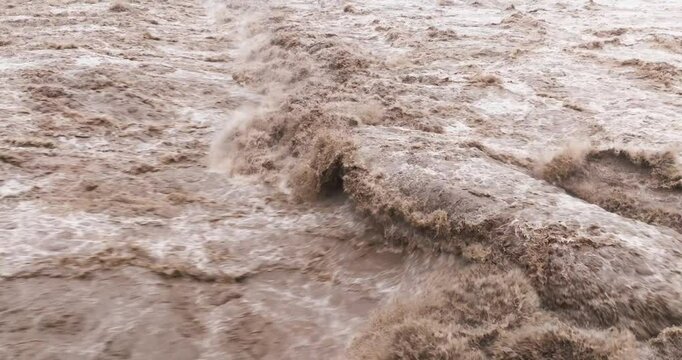 close up of flood water flowing in the river