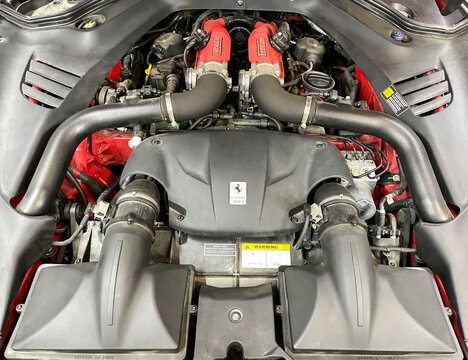 Engine motor of Ferrari California t car V8 BiTurbo, 3.9L, 560 hp with emblem. Ferrari supercar motor engine close-up. Ferrari California T. Italian car. 