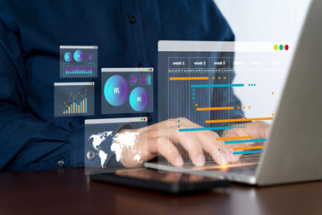 Fototapeta premium Businessman working with data management system on computer to make report with KPI