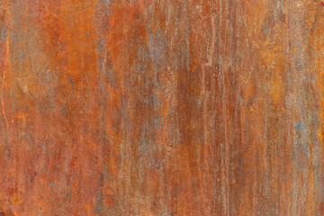 Orange Rust Stains on Weathered Steel Plate with Brown Metal Wall Background