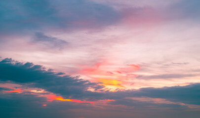 Fototapeta premium 4k Aerial of Cloud with sunset sky background in Thailand,Cloudscape time lapse background Dark red purple sunset sky Nature background, sunset in the clouds