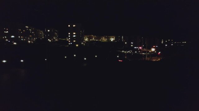 People with flashlights on a dark street, a flash mob of people against the dark, a protest of people with flashlights, people walking at night with flashlights