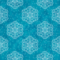 Winter seamless pattern with snow flakes on blue background. Vector Christmas seamless pattern. Hand drawn white snowflakes and blue watercolor texture for winter holidays cards and wrapping paper