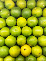 Fresh Orange Citrus fruit top view Background. Bunch of citrus fruits, Summer tray market agriculture farm full of organic fruits It can be used as background