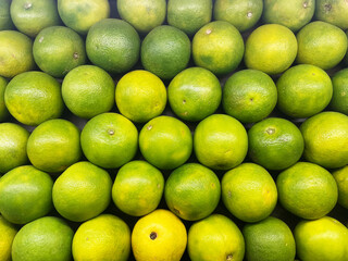 Fresh Orange Citrus fruit top view Background. Bunch of citrus fruits, Summer tray market agriculture farm full of organic fruits It can be used as background