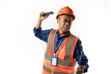 Asian adult male construction worker who looks very angry and wants to throw his cell phone during a voice call, industrial and construction concept, isolated white background.