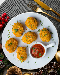 Homemade chicken nuggets with tomato sauce. Top view table with decoration.