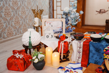 Traditional decor for the national Korean holiday of the baby's first year. birthday. divination on objects. inscriptions in korean.