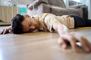 Young Asian Man Fainted on The Floor at Home
