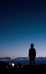 Obraz premium silhouette of a person on a mountain top