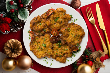 Shrimp Tortillas. Traditional tapa of flour and egg dough with shrimp. Top view table with christmas decoration.