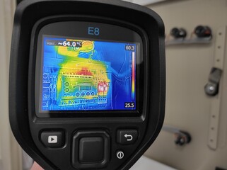 Inspection with a building thermal imager.