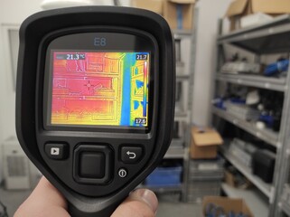 Inspection with a building thermal imager.