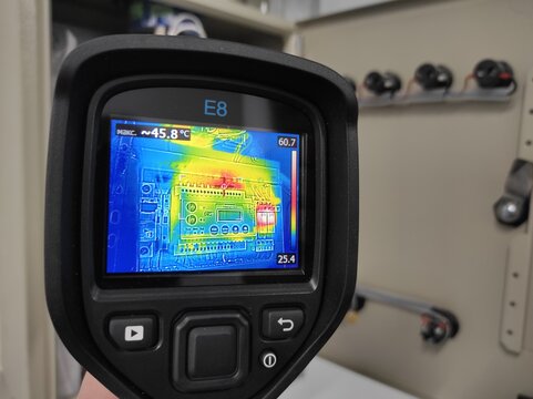 Inspection with a building thermal imager.