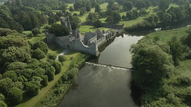 Panorama Of Adare Desmond Castle At The Rivershore Of Maigue In Ashgrove, Adare, County Limerick, Ireland. Aerial Drone Shot