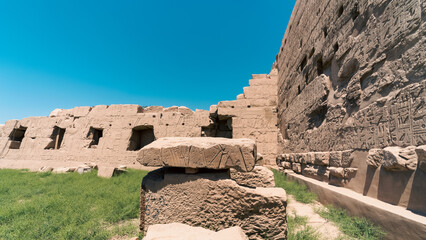 antique temple with hieroglyphs on the wall in egypt
