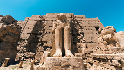 Feet of an ancient statue of Pharaoh in the Karnak temple in Luxor