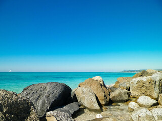 Stones on beach in Vada, Italy.