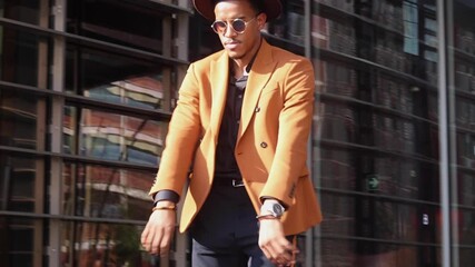 Successful business man walks out of office confidently to outside office building 