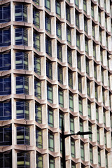 1960s modernism: post-war skyscraper; architectural symmetry, brutalist design, Centre Point skyscraper facade at Tottenham Court Road, Oxford Street, London UK, an iconic brutalist skyscraper