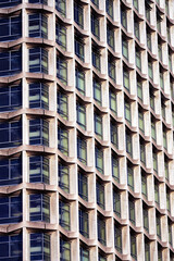 1960s modernism: post-war skyscraper; architectural symmetry, brutalist design, Centre Point skyscraper facade at Tottenham Court Road, Oxford Street, London UK, an iconic brutalist skyscraper