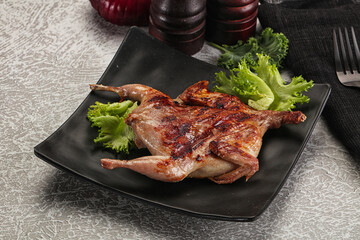 Grilled quail in the plate