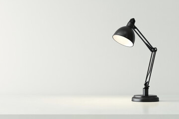 Black desk lamp on empty wooden table with copy space. Minimalistic workspace interior