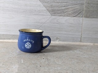 Blue work text cup isolated on white background