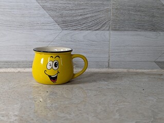 yellow smile cup isolated on white background
