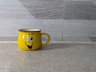 yellow smile cup isolated on white background