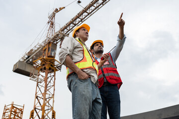 Asia engineer man worker and India engineer man working with crane background	