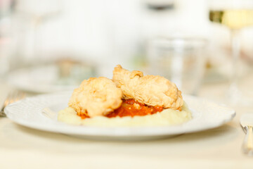 Close up on italian traditional northern food on a restaurant table. Many dishes are visible.