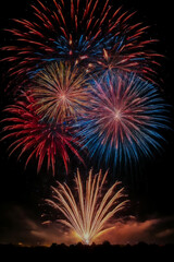 colorful red white and blue fireworks in the night sky.