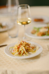 Close up on italian traditional northern food on a restaurant table. Many dishes are visible.