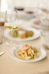 Close up on italian traditional northern food on a restaurant table. Many dishes are visible.