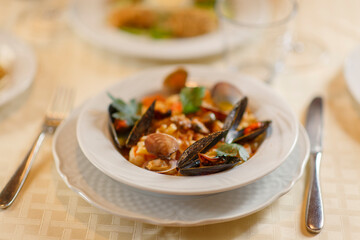 Close up on italian traditional northern food on a restaurant table. Seafood pasta recipe.