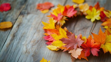 Fototapeta premium DIY Autumn Crown Project for Kids Featuring Vibrant Fall Leaves on Rustic Wooden Background