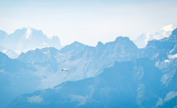 Tranquil scene of a glider over the Swiss Alps