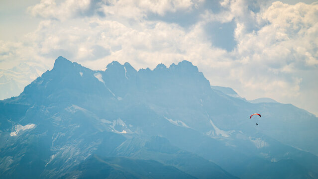 Paragliding adventure against the Swiss Alps backdrop