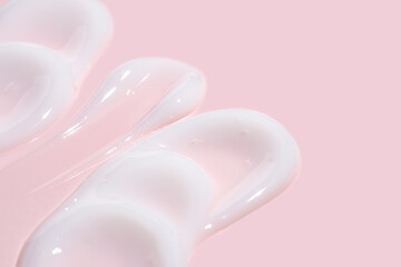 Swirled Skincare Cream Texture on a Pink Background
