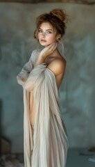 Fototapeta premium Elegant Portrait of a Young Woman in Sheer Fabric