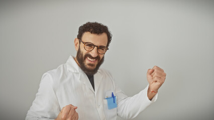 Cheerful middle-aged bearded man in labcoat celebrating success on white background
