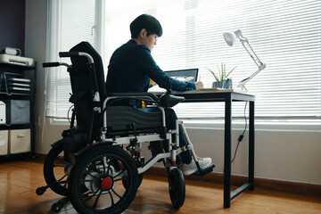 Young woman with disability making notes at her workplace while working in office