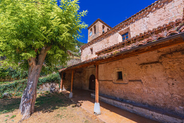 Orbaneja del Castillo, Spain. Exterior view of the Romanesque-style Church of Saint Mary built in 12th century