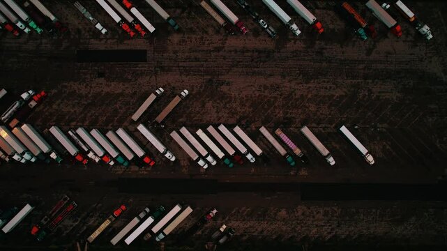 Many trucks parked at truck stop at night, Wisconsin, Aerial view