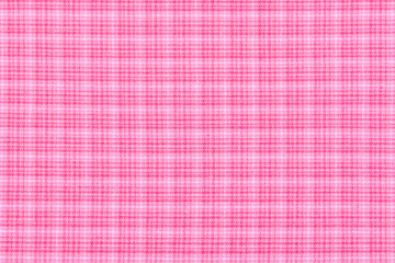 a background texture of pink plaid fabric