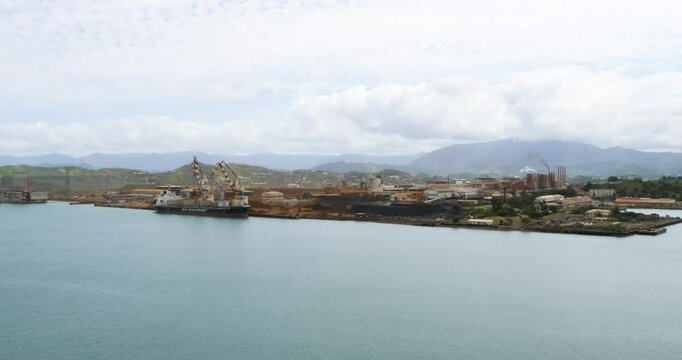 Noumea New Caledonia. Cranes unload nickel ore off cargo ship